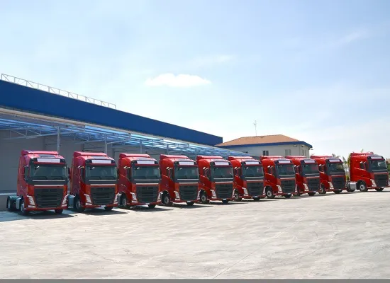 Fleet of trucks lined up outside of a Massachusetts Trucking Company, N&D Transportation